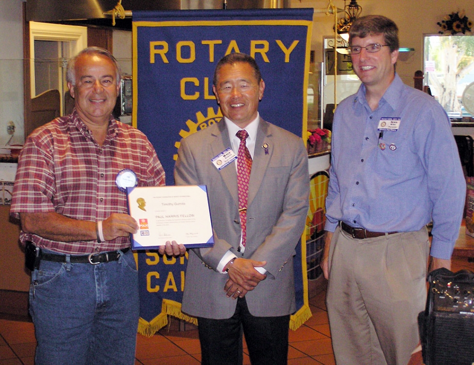 Tim Gurrola, left, and Sean Morris are pictured with visiting Sun Rise Rotary District Governor Wade Nomura.