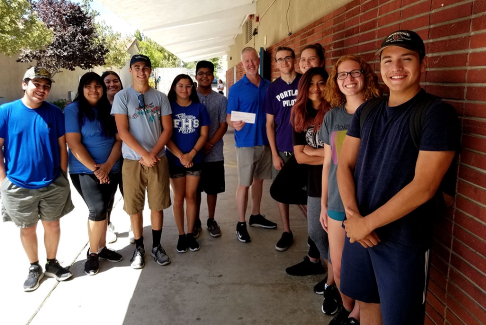 The Rotary Club of Fillmore made a $200 donation to FHS Band Boosters on behalf of the Santa Clarita Runners, for their first place Team Challenge win in the Rotary 10K Run, and for having the most participants. Left to right: Carlos Vasquez, Dalila Lopez, Melissa Tovar, George Mooradian, Lilian Diaz, Jesus Ceballos, Mr. Gregory Godfrey, Matthew Bartels, Olivia Palazuelos, Elia Lopez, Isabella Palazuelos and Eddie Gamez. Photo Courtesy Martha Richardson.