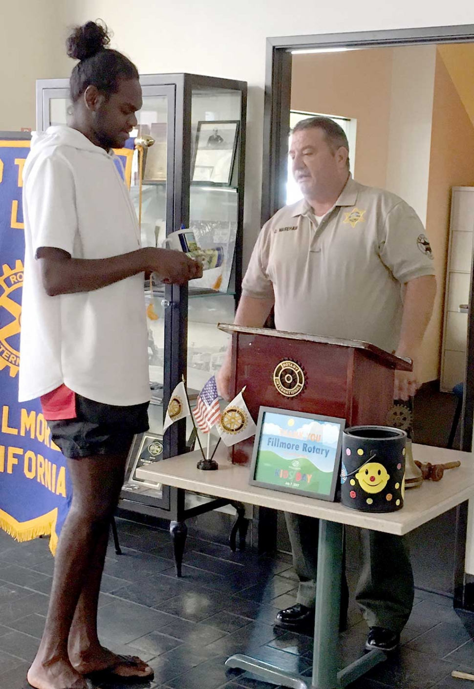 Rotary Says Goodbye to Exchange Student. Rotary Exchange Student Josh Cox, from Australia, presented his last program to the Fillmore Rotary club before heading back to Australia. Pictured is Rotary President Dave Wareham presenting Josh with a Rotary mug for all his participation. Photo Courtesy Martha Richardson.