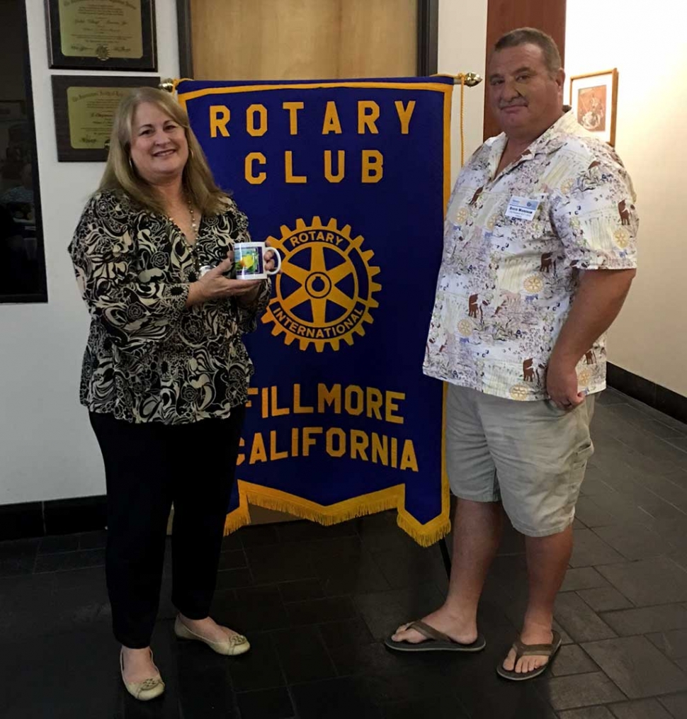 Fillmore Rotary President Dave Wareham presented Renee Swenson, the newest Rotary member, with a Rotary mug following her program. Besides being a new member she and her husband Eric have only lived in Fillmore for nine months. She is an event planner and has created events with thousands of people in attendance. Renee and her husband have a passion for electric cars and started the first electric car club several years ago. Photo courtesy Martha Richardson.