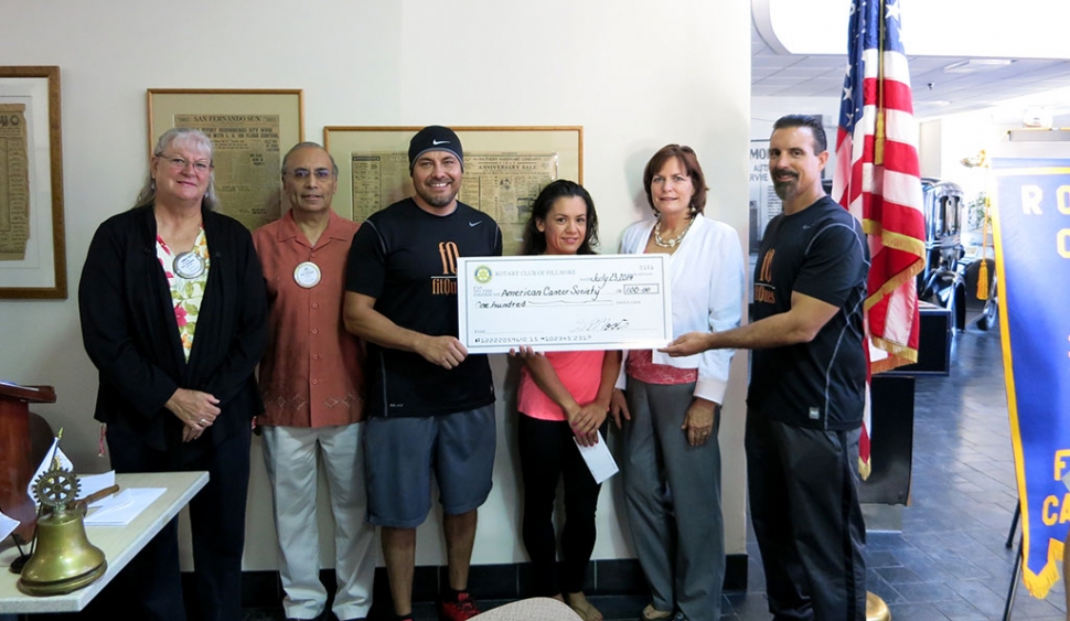 The Rotary Club presented checks to two winners of the 5/10K Run. The checks were for their favorite charities. The Sheriff Foundation supplies funds to help communities and to enhance services in the Sheriff Department.