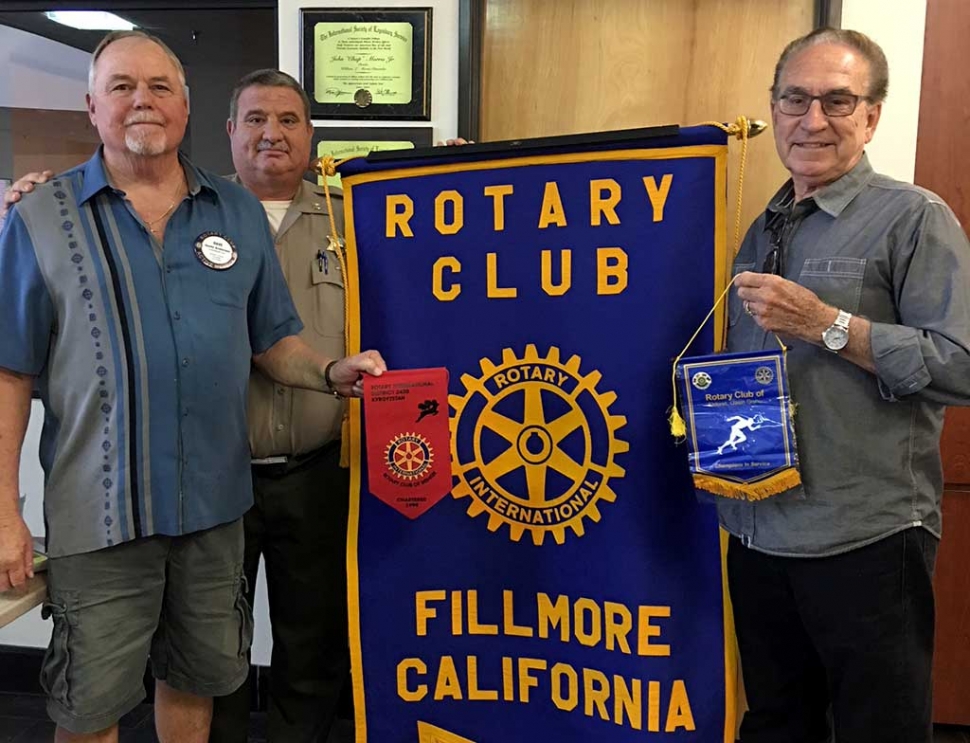 L-R Rotary members travel. Dave Andersen visited the Rotary Club of Bishkek, Kyrgyzstan and Rev. George Golden visited The Rotary Club of Eddoret, Kenya Africa. Each brought back banners from those Clubs.