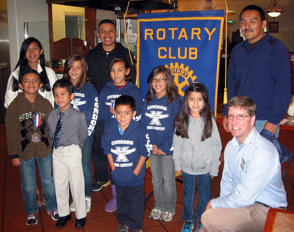 Coaches and members of the Condor Cross Country Team. Kneeling on right is Sun Risers President Sean Morris.