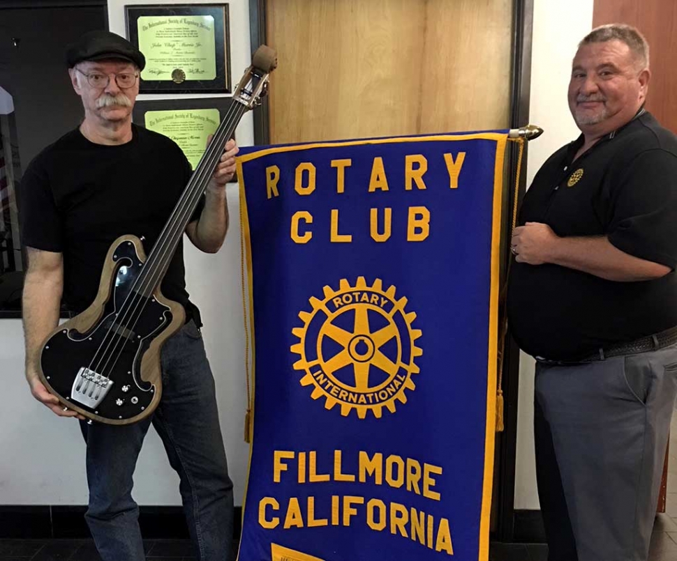 Bruce Johnson standing with Dave Wareham, is our local Luthier presented the latest program to the Rotary club. He has a craftsman shop where he crafts specialty guitars, in the old school way and sells them on his website. He is promoting a Jam Fest every Sunday, near the train station, beginning April 22. It will be a time when locals can join in or just come to listen. Photo courtesy Martha Richardson.