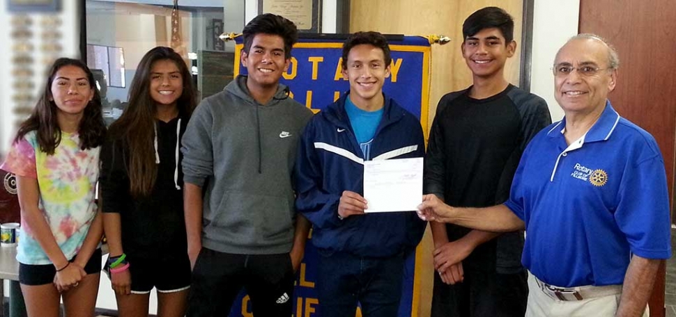 Members of the Fillmore High School Cross-Country Team were presented with a check for $150 by Joe Aguirre of the Fillmore Rotary Club for their win in the Heritage Valley 5K Team Challenge. Pictured (l-r) are Diana Perez (11th), Vanessa Avila (10th), Sergio Perez (11th), Everardo Garcia Magana (12th), and Nick Villela (11th), Joe Aguirre. Photo Courtesy Cindy Blatt.