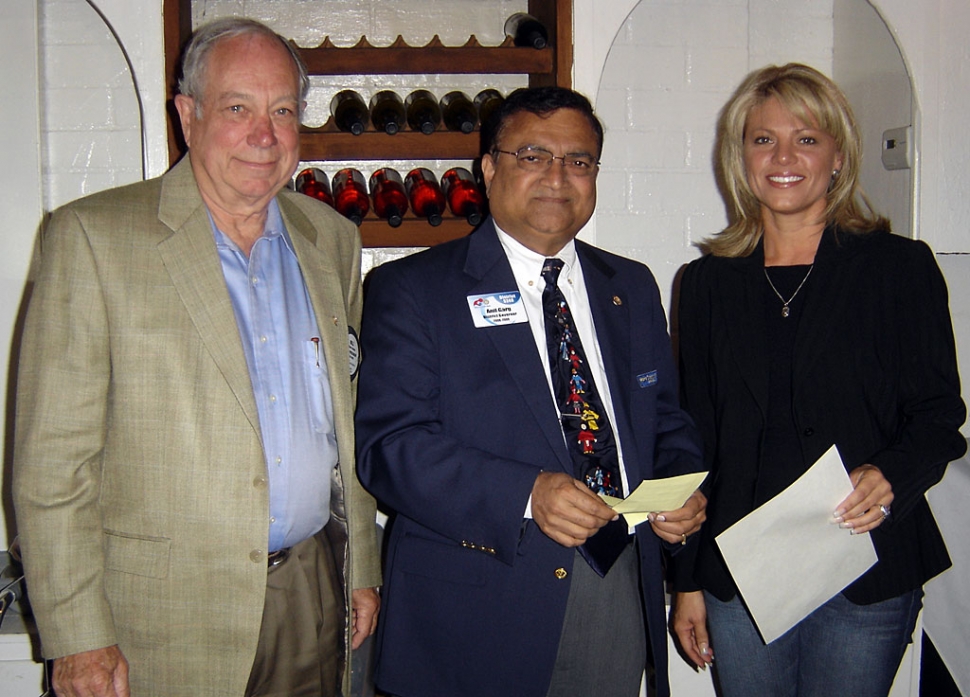 Shown (l-r) are Bill Shiells, President, Anil Garg, District Governor and Diane Torrence new member of noontime Rotary.