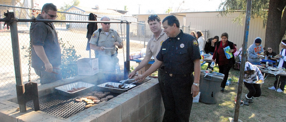 The Fillmore Fire and Sheriff Departments barbecued lunch for the students at Sierra High School on Friday, December 11th. Pictured (l-r) is Sheriffs Sgt. Dave Wareham, Deputy Jerry Petersen, Captain Tim Hagel, and Fillmore Fire Chief Rigo Landeros.