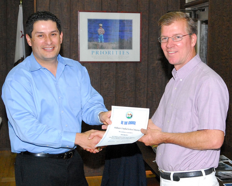 School Board President John Garnica with Kirk Richter. Kirk Richter received “Be the Change” certificate at Tuesday night’s meeting.