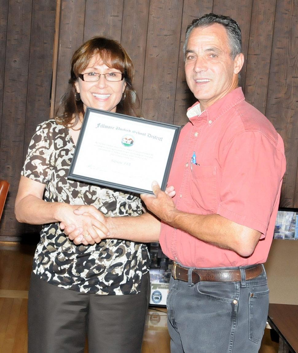 (l-r) Virginia De La Piedra recognizes Joe Ricards (and all of Fillmore's FFA members) for wining many awards at the Ventura County Fair.