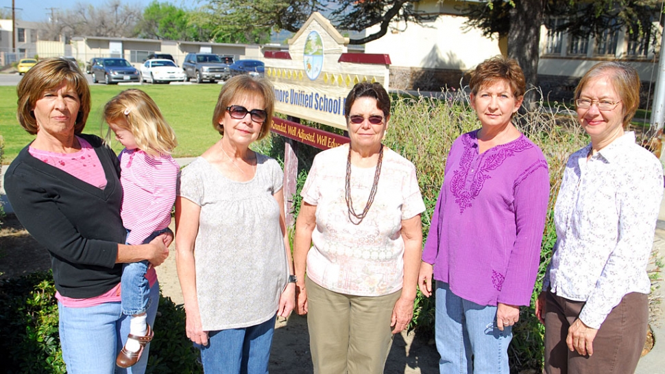 Faces of the Budget Cuts: Pictured left to right - Debby Blaylock, computer lab, 26 years employed losing 1.75 hours a day; Michele Anderson, library clerk, 17 years employed losing 10 days and 1 hour a day; Linda Boynton, computer lab, 29 years employed, eliminated; Sheila Duckett, 29 years employed, computer lab, losing 1 hour a day; Jan Faulkner, 1 year employed, librarian, losing 33 days and 3 hours a day. These cuts are part of the approximate 589 days per year and 31 hours per day that will be lost serving Fillmore Unified students.