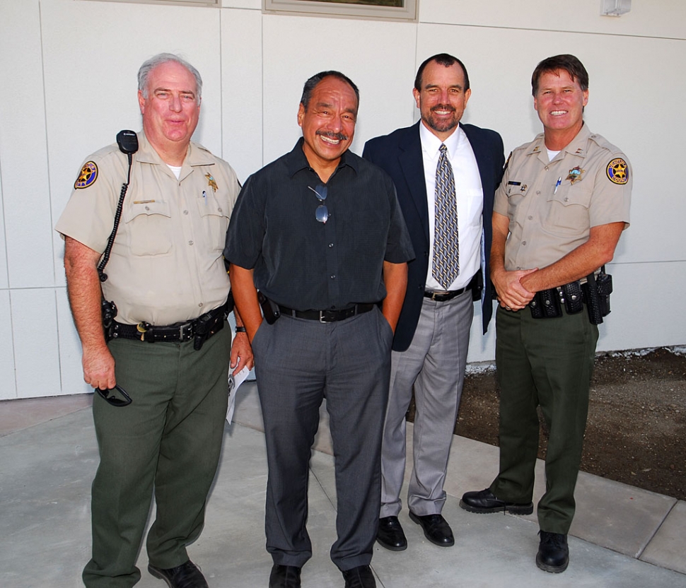 Sierra High School dedication was well attended by local officials, inclucing school board members, and parents and students. Pictured (l-r) are Deputy Peterson, Epi Torres, John Wilber and Capt. Tim Hagel. The school will hold 140 and cost $1.7 million. The Gazette will present a story on the dedication next week.