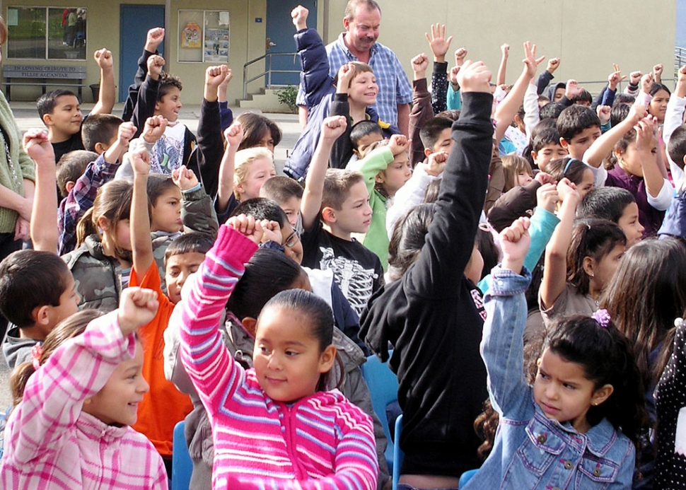 Piru students pump fists to simulate heart beats.