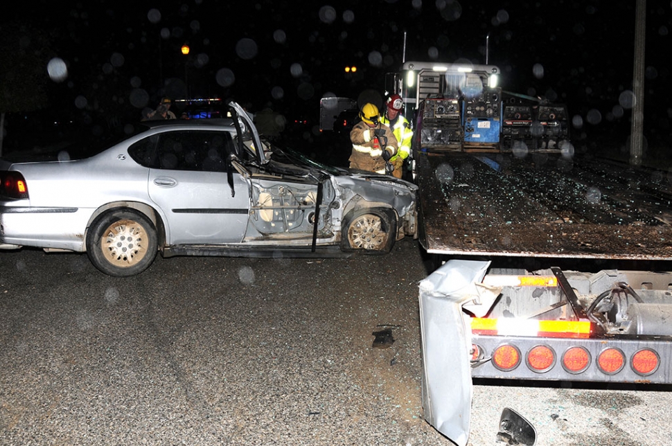 On Wednesday, February 27th at 7:36 p.m. on E Street in Fillmore, a silver Impala crashed into the back end of a flatbed towing truck parked on River Street, just east of the water reclamation plant. Cause of the accident is still under investigation and no injuries were reported at the time of the crash. The Impala’s passenger side door was ripped off and is seen hanging on the left rear of the truck. 