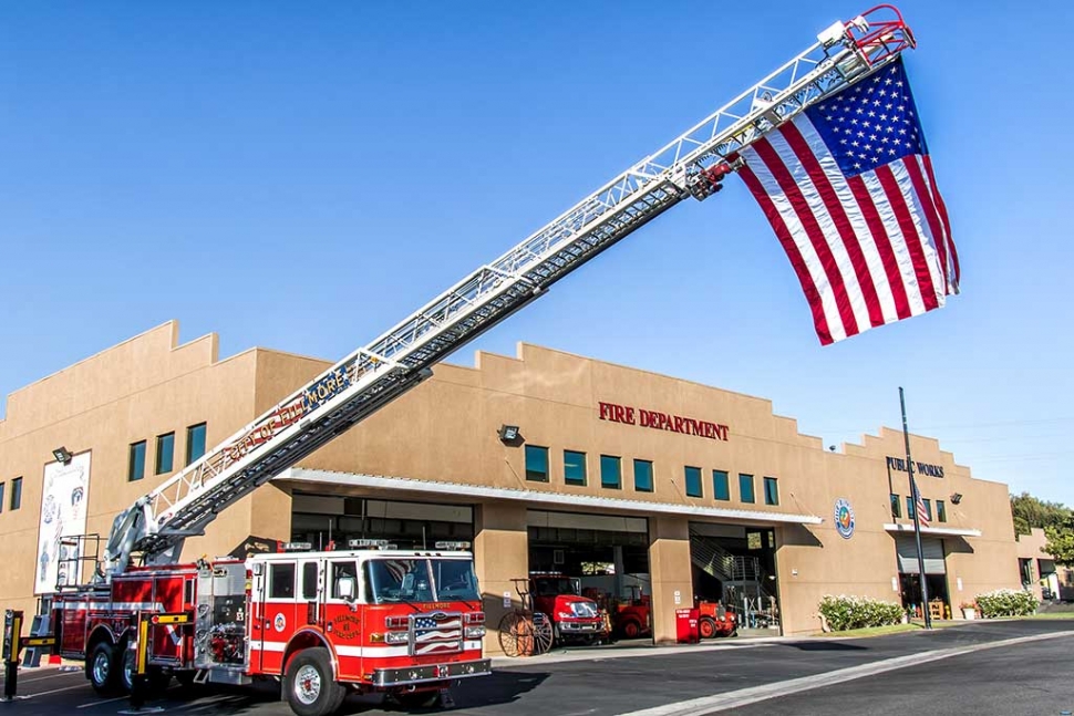 Fillmore Fire Department held a Memorial for the 15th Anniversary of 911 this past Sunday at 6:30am by flying an American flag attached to the top of the ladder and served refreshments to the community. Photo by Bob Crum.