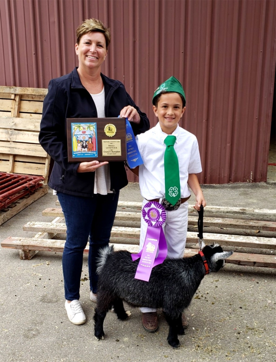 Pictured is Ethan Zavala of Sespe 4H who won Supreme Grand Champion, with his Registered Pygmy Goat at this year’s Ventura County Fair Small Livestock Show. Pictured with Ethan is project leader Kerrie Allen.