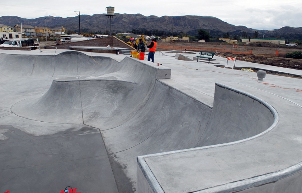 Crews were out last week watering down the newly-poured concrete skateboard bowl; this week Mother Nature is taking care of it for us. The skateboard park is expected to open December 22nd. Merry Christmas Skaters!