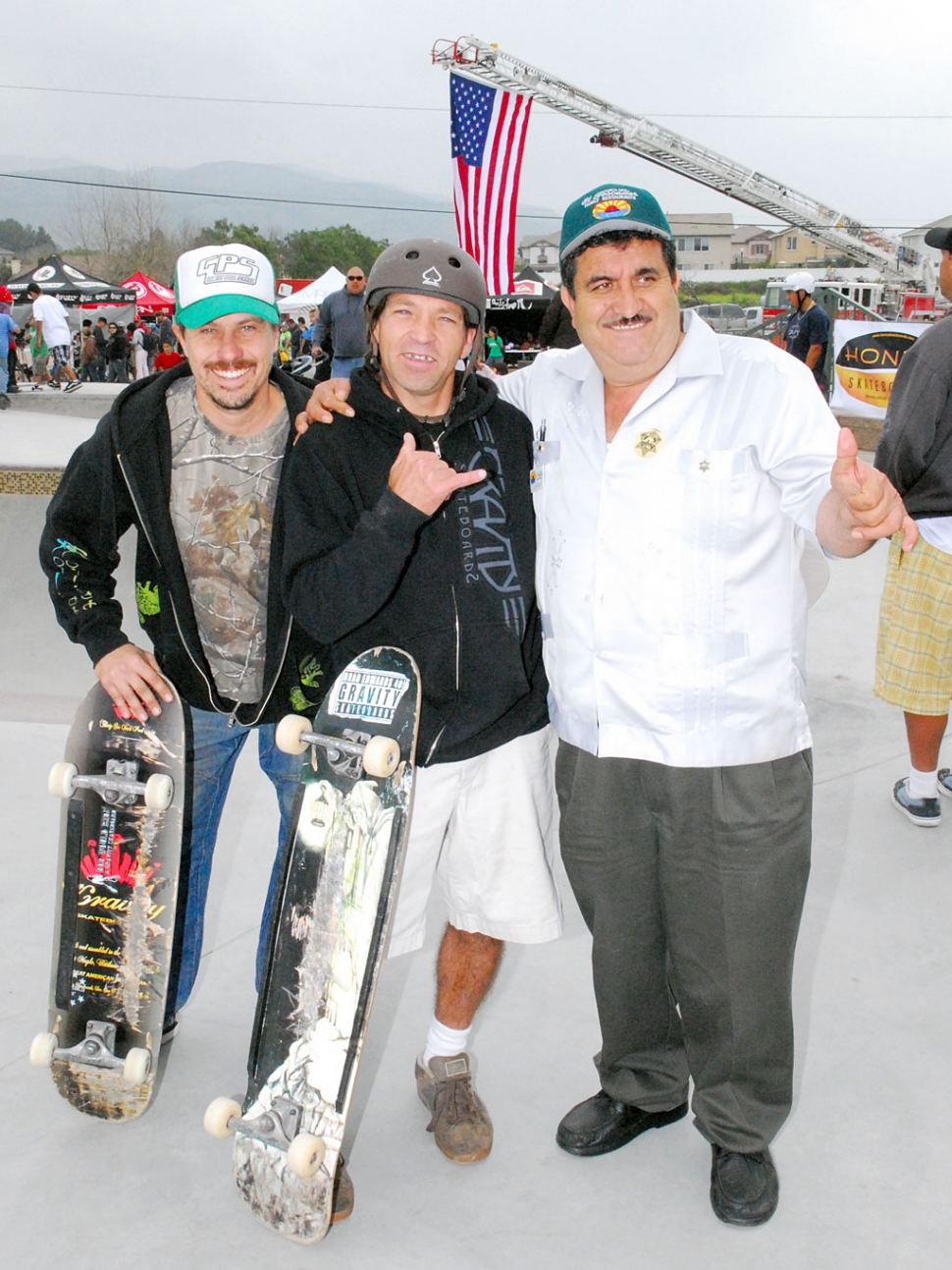 Right, Jesus “Chuy” Ortiz, owner of El Pescador, is pictured with skate pro’s at the new skate park.