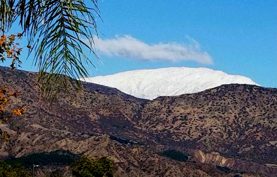 Beginning early Monday morning into the evening a rainstorm blew through Ventura County bringing heavy rains and winds, but it left behind Christmas week snow on the Sespe Mountain Range.