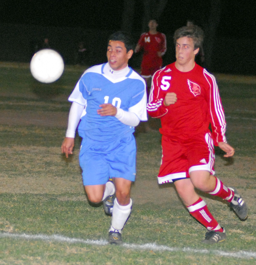 Braulio Martinez #10 tries to get the ball under control and keep it away from Bishop.