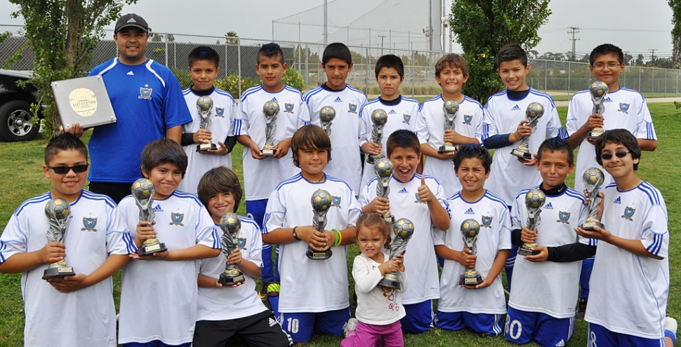 From left to right, top row: Coach Ignacio Calderon, Ivan Zepeda, Jose Valdez, Enrique Gutierrez, Edgar Rea, Michael Garcia, Saul Santarosa, and Jesus Zamora. Bottom row: Cristian Hernandez, Cristian Rosales, Jaime (JJ) Gonzalez, Julian (Ju) Calderon, Water Girl: Isabella (Bella) Calderon, Cristian Candelario, Joel Garza, Alex Rodrigez, Jesus (JJ) Hinojosa. Not in picture: Coach Octavio Hernandez, Andres Avila and Luis Posada.