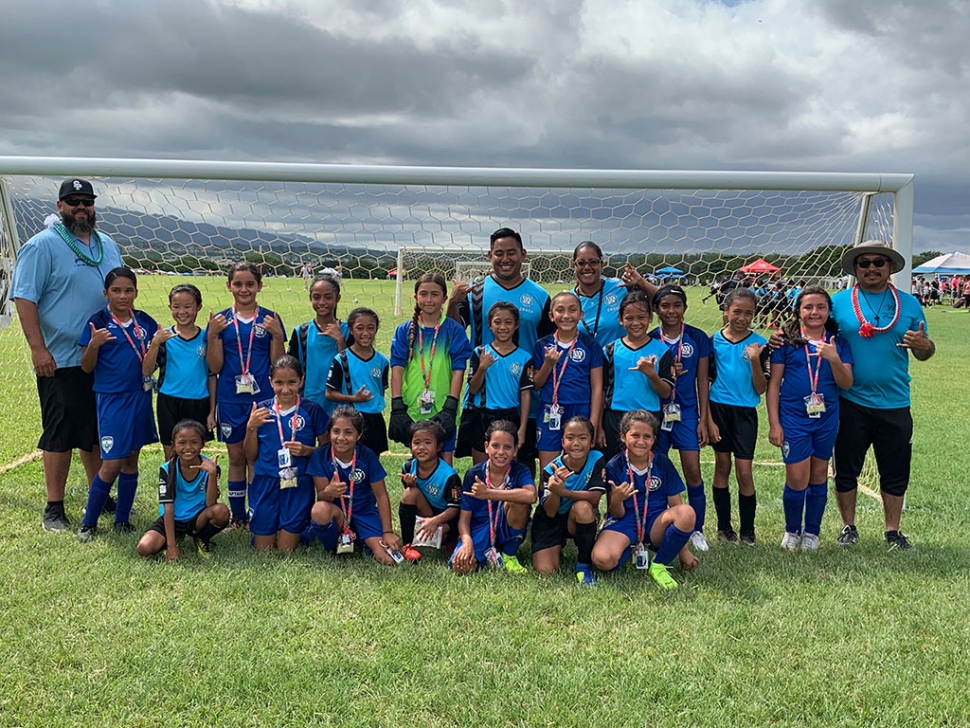 Pictured above and below is the Fillmore ASYO Warrior’s 10U Girls Team traveled to Hawaii to compete in the AYSO National Games. Pictured is the team holding up the “Hang Loose” sign while they were on the island. Photo Credits Arnold Munoz.