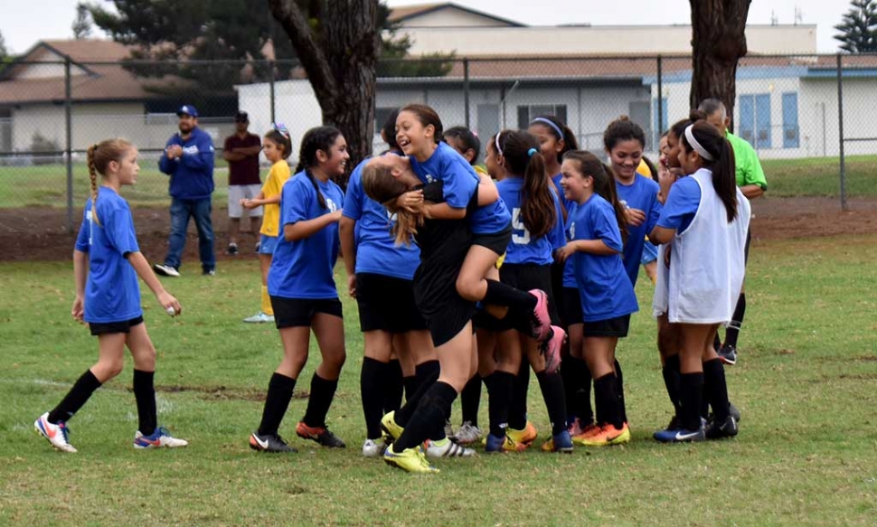 Victory – CU players experience the thrill of victory after the final whistle.