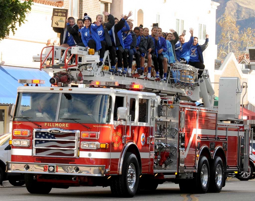 Saturday, March 3rd at 4:15pm the Fillmore Flashes Girls Soccer Team was welcomed home with a victory parade down Central Avenue as they returned from their 3-1 victory against Azusa High School for the CIF Southern Section Girls Soccer Division 7 Championship Title. This was the first time in 31 years the Flashes have played in the CIF finals. The Fillmore Fire Department allowed the team to ride on top of Engine 91 as they escorted them downtown to celebrate their historic victory. This win advanced the team into the Southern California Regional Girls Soccer Championship 1st round game at home against Rosamond High School this past Tuesday, March 6th, where they again took the victory, 7-1.