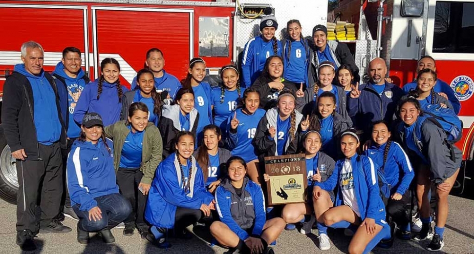 Pictured is the team in front of Fillmore Fire Engine 91 after riding into town on top as they celebrated their victory.