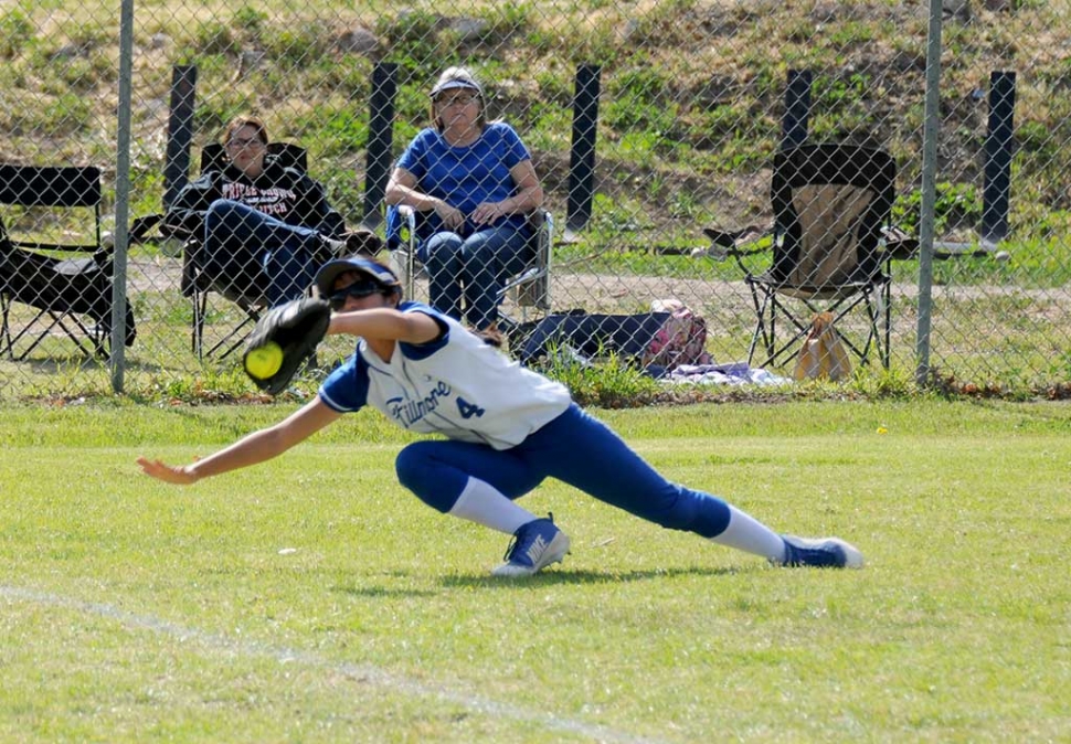 Varsity Outfielder Ebony Venegas makes a diving catch in left field during the St. Bonnaventure game this past Thursday.