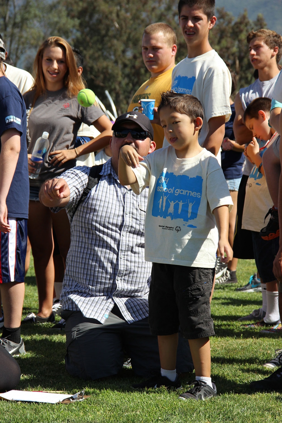 Reece at the tennis ball throw competition