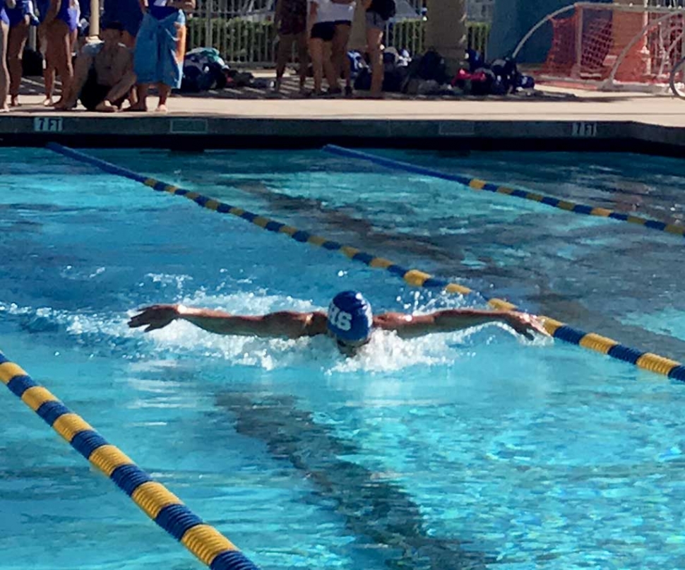 Flashes JJ Gonzalez winning the 100 yd. Butterfly relay at Trinity Classical on March 15th.
