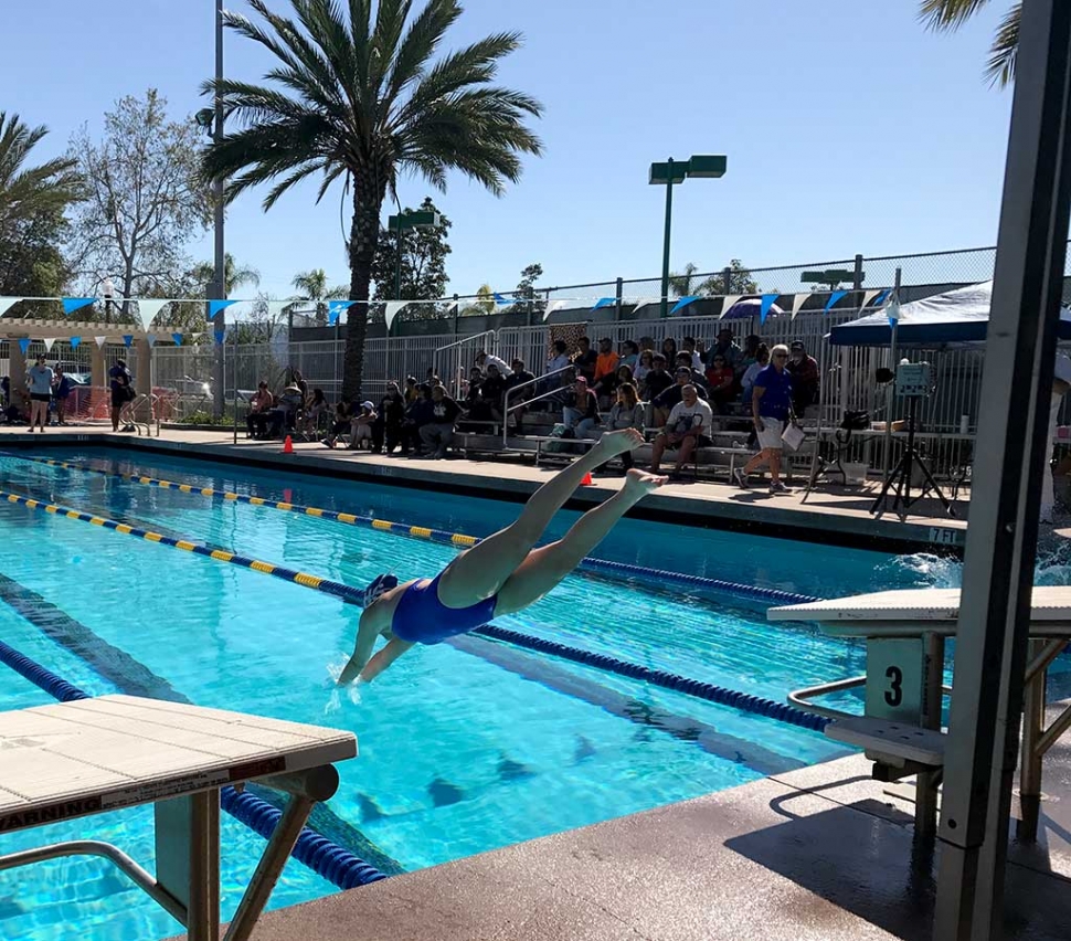 Fillmore’s Kate Johnson getting a flying start in the 100 yd. Breaststroke relay.