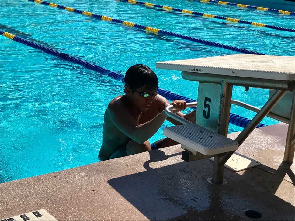 Flashes swimmer Jose Ruiz getting ready for backstroke start in the meet against St. Bonaventure.