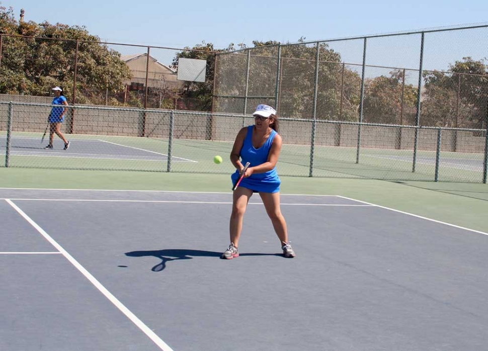 The Fillmore girl's varsity tennis team played against Carpinteria's junior varsity team. Fillmore's number one player Michaela Boniti won all three of her matches with the last being a close finish scoring at 7-6. Elizabeth Castaneda at number two, won two out of three of her matches scoring 6-1,6-1, and 2-6. Final score - Fiilmore 6 Carpinteria 12. (above) Karime Renteria warming up her backhand.