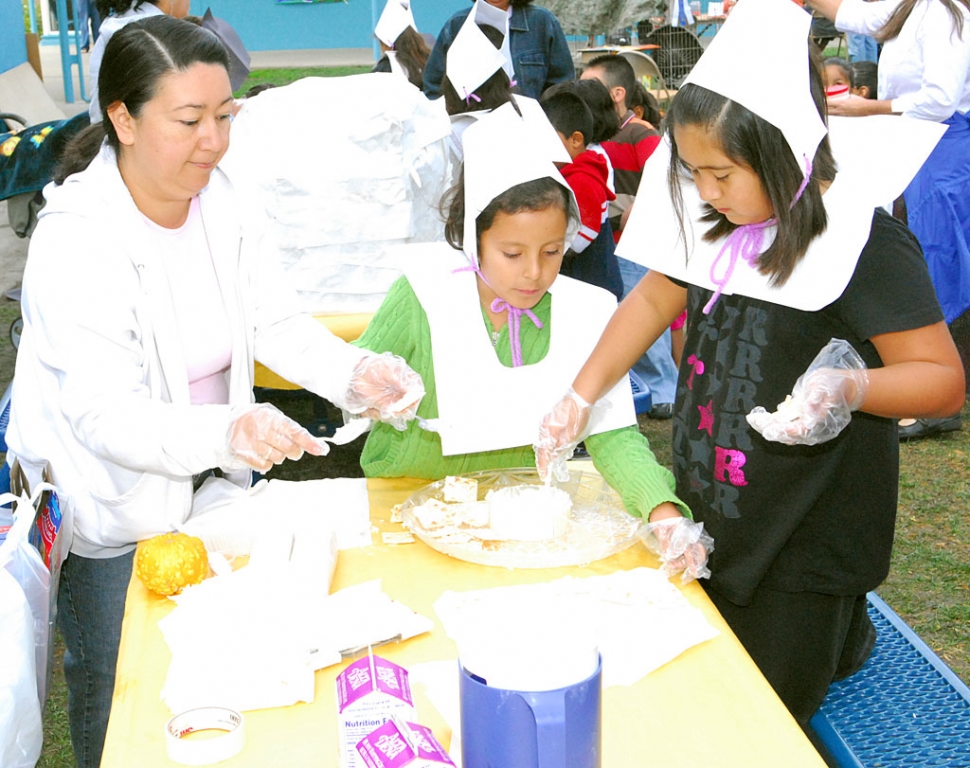 A couple of cute Pilgrims helped prepare a Thanksgiving feast on Tuesday, November 25, as San Cayetano’s third grade class put on a small scale reenactment of the Pilgrims’ life around the time of the first Thanksgiving in 1621. Some of the activities included in the day’s festivities were cooking, needlepoint, games, Indian writing and Old English writing.