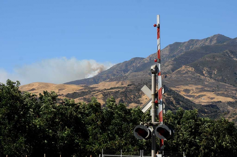 The Thomas Fire rises over the ridge of the Sespe Mountain range northwest of Fillmore on Tuesday afternoon.