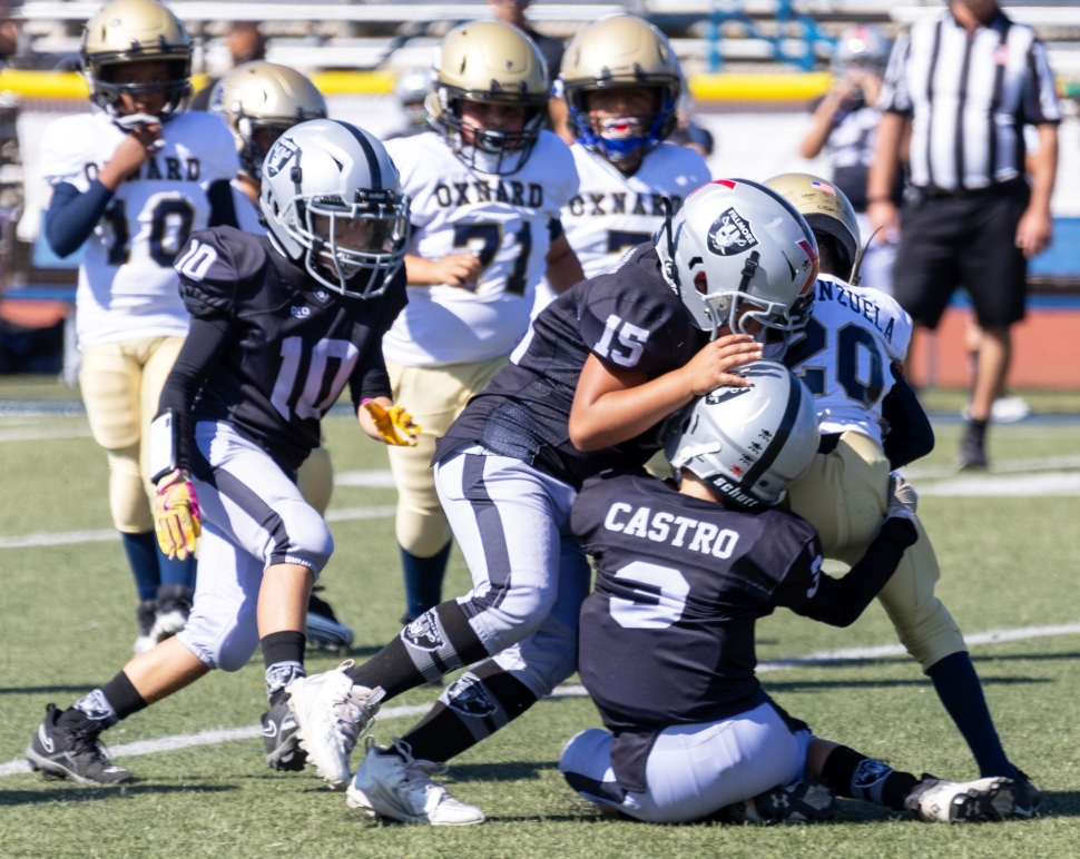 Pictured is Raiders Bantam Silver defense taking down team Oxnard in this past Saturday’s game. Photo credit Crystal Gurrola
