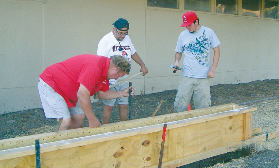 Above, Harold Foy (l), Owner , Fillmore Building Supply, Mike Munoz (center), father of Roberto Munoz and Roberto (Eagle Scout candidate) laying concrete in forms for the bench on the memorial site. June 2012. Pictured left, a 12x20” plaque will be installed on the front face of the concrete bench by Harold Foy in August 2012. The bronze plaqye was fabricated in New York and is provided by the Grtiz-MacKenzie Family to the project.