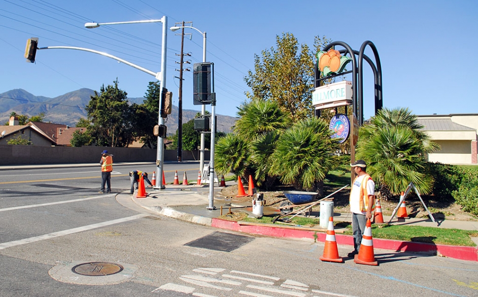 The new traffic signal at the corner of River and A Streets is almost ready for operation. Workers can be seen finishing the electrical work and testing.
