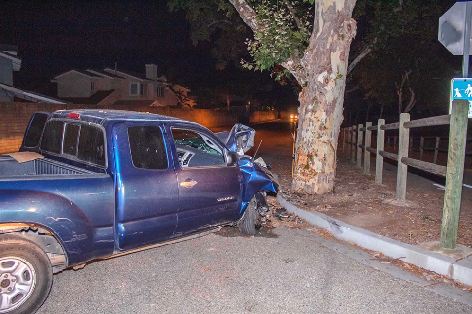 On Tuesday, July 19th, 2022, at 9:40pm, Fillmore Police Patrol Services, Fillmore Fire Department and AMR Paramedics were dispatched to a reported traffic collision at Old Telegraph Road and B Street, Fillmore. Arriving deputies reported a single blue Toyota Tacoma into a tree with no occupants inside; the driver fled the scene, no other vehicles were involved. Deputies remained on scene for tow. Cause of the accident is under investigation. Photo credit Angel Esquivel-AE News.
