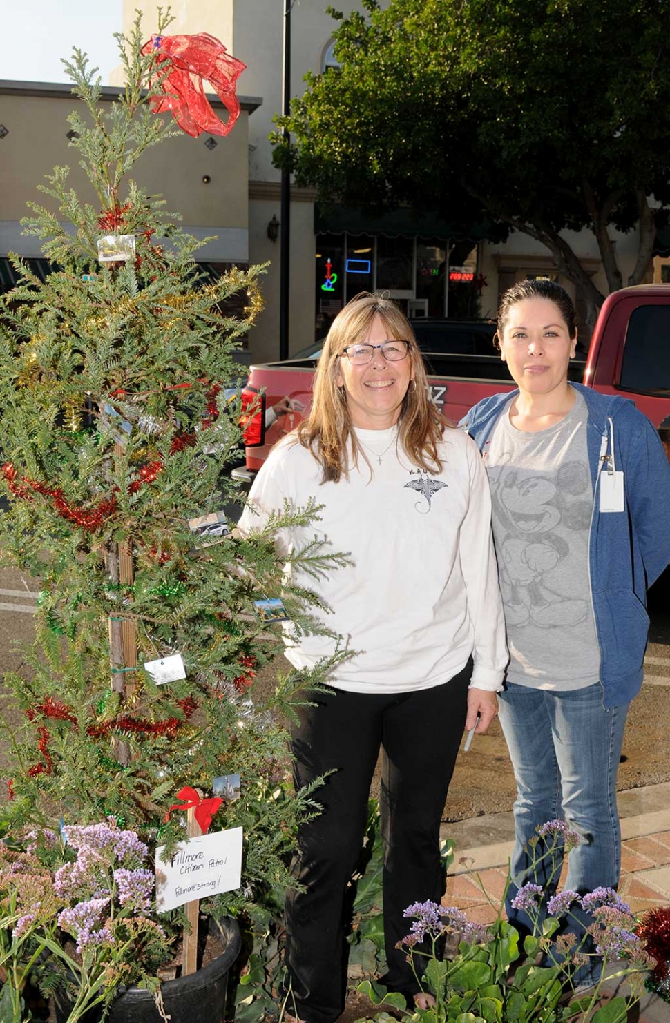 Lisa Hammond (left) and a friend were seen on Central Avenue decorating one of the many Christmas trees that lined Central Avenue downtown. Each tree is decorated in it’s own way to represent the club or organization. These ladies were decorating their tree for the Fillmore Citizens Patrol.