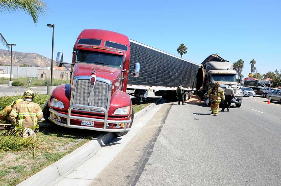 At approximately 1:00 p.m. Tuesday, an eighteen-wheel tractor-trailer (identified belonging to JSA Soil) carrying a load of sawdust, drove into the rear of another tractor-trailer on Hwy.126 across from Taco Bell. Substantial damage was done to both parties.