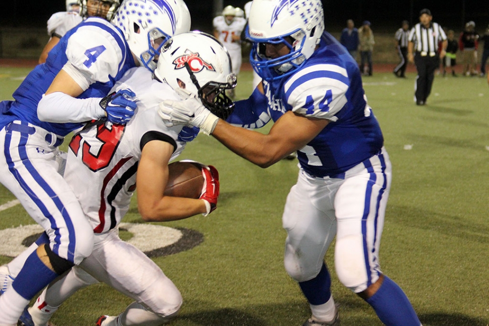 Varsity #4 Hayden Wright and #44 Justin Coert get the tackle. Photos courtesy Crystal Gurrola.