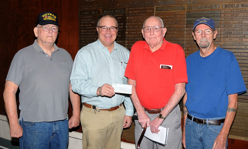 On Friday morning, October 11th, at the Fillmore Veterans Memorial Building, John Pressley of Fillmore donated a check for $1,000 to the Veterans Memorial building fund towards the roof repairs needed for the building.