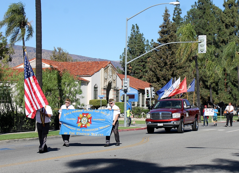 On Thursday, November 11th at 10am, over 50 cars drove down Central Avenue and in those cars, local Veterans from Fillmore, Piru, Bardsdale and surrounding areas all riding in style. Both classic and new cars participated. People gathered on Central Avenue waving American flags, showing their respect for our local Veterans. Leading the parade, Fillmore VFW 9637.Grand marshals for this year’s parade were Raymond S. Ponce, US Army Sergeant, Korea, and Lupe Sanchez Ybarra, US Army Corporal, Korea. After the parade everyone gathered at Fillmore City Hall for a ceremony.