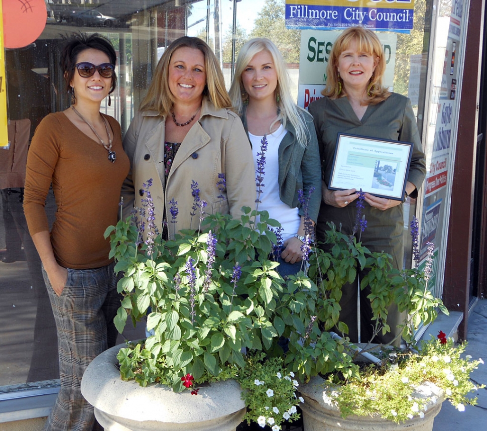 (r-l) Donna Johanson, Lauren Johanson, Shelly Reiman, Brandy Lengning receiving award for Chivas Skin Care.