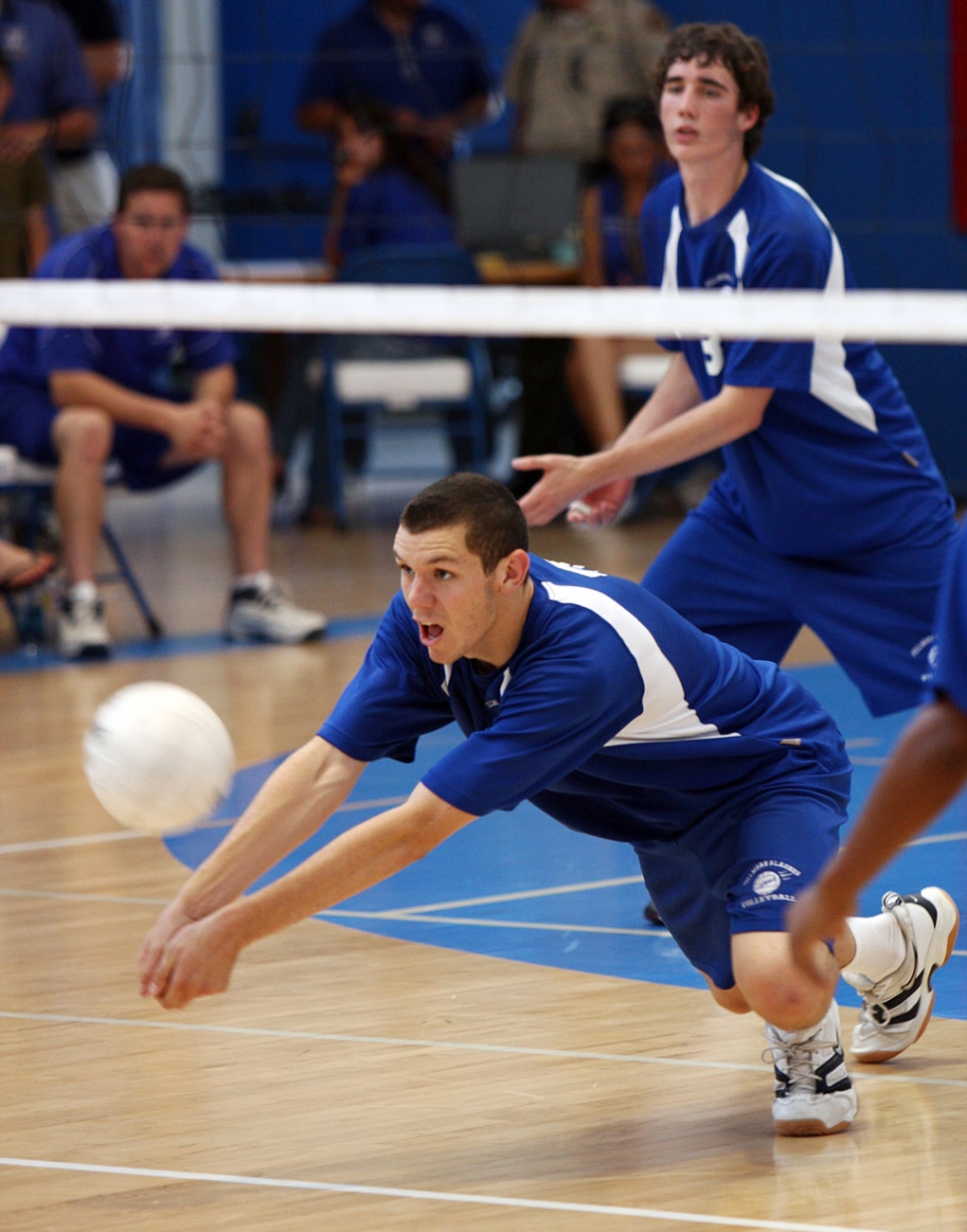 Noah Aguirre dives for the ball against Glendale Adventist. Aguirre had 18 digs and 17 kills in the game. It took Fillmore 5 games to beat Glendale: 25-12 (F), 25-15, 25-2 (F), 25-17, 15-8 (F). (Volleyball photos by freezing the moment photography)