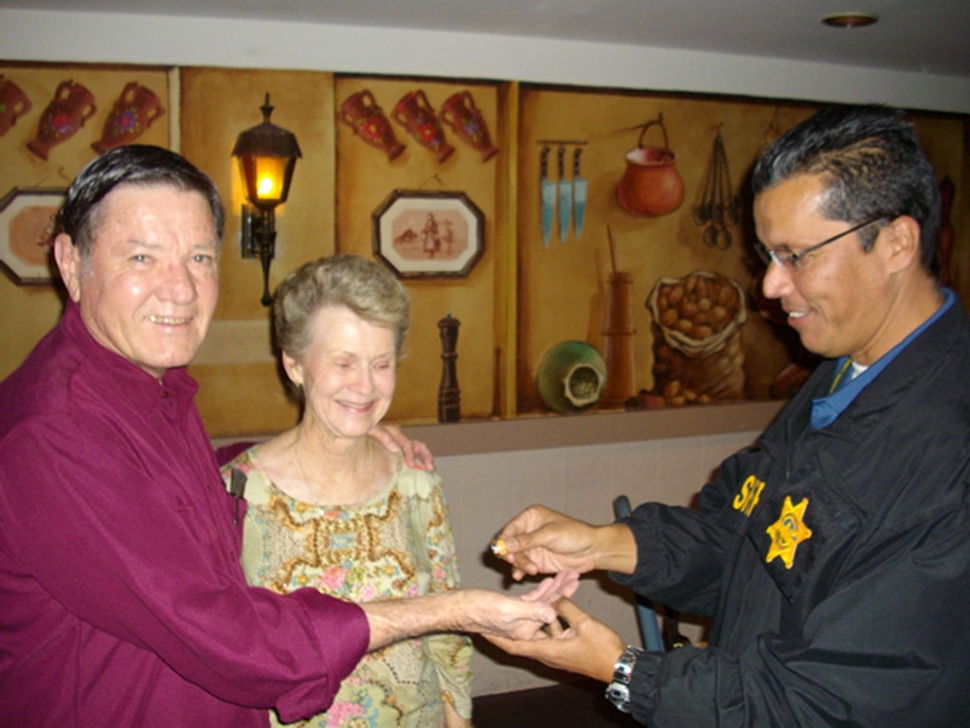 Detective Marty Luna giving the ring to Richard and Donna.