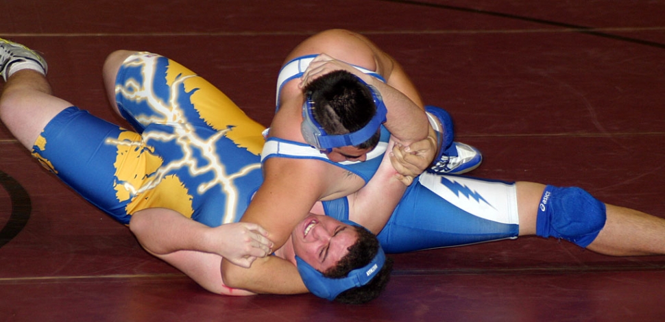 The wrestler above tries to avoid being pinned by Fillmore.