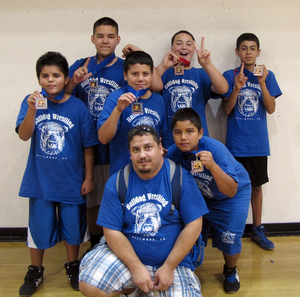 Six Fillmore Middle School Wrestlers placed at the Ventura County Middle School Wrestling Championships on Sunday, November 4. The Championships were held at Santa Paula High School. Schools that participated were Fillmore Middle School, Isbell (SP), Balboa (VEN), Matilija (OJAI), Frank Intermediate Middle School (OX), Freemont Middle School (OX). Pictured are Fillmore Wrestlers Adrian Bonilla 1st place 135lbs, Abraham Cervantez 1st place 130lbs, Juan Martinez 1st place 110lbs, Juan Perez 1st place 140lbs, David Estrella 1st place 195LBS, Blake Palacio 2nd place 175lbs and Coach Manuel (chicken) Ponce. This was a great season for these boys, they accomplished what they worked so hard for.